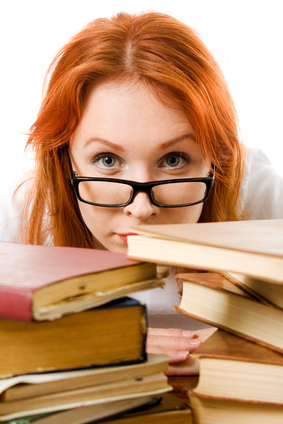 Woman using Too Many PMP Exam Prep Books